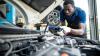 A mechanic testing a vehicle's roadworthiness
