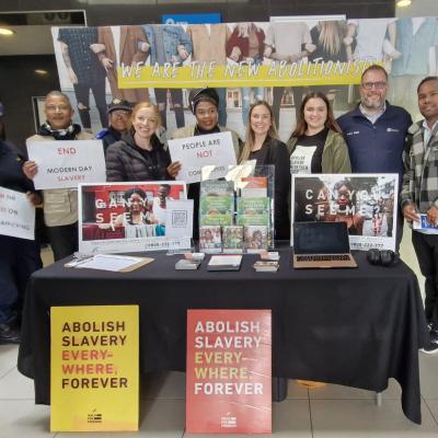 Group shot of MEC Jaco Londt with staff from DSD, A21, PRASA, and SAPS