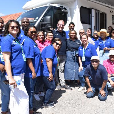 Western Cape Minister of Social Development Jaco Londt with DSD staff in front of the DSD mobile office